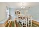 The dining room features a stylish table and chairs, a china cabinet and a colorful rug at 10416 Moshie Ln, San Antonio, FL 33576