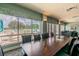 Inviting dining room with large windows overlooking a pool and patio area at 10416 Moshie Ln, San Antonio, FL 33576