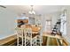 Dining room featuring a table, chairs, and a view into other rooms of the home at 10416 Moshie Ln, San Antonio, FL 33576