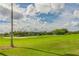 Picturesque view of the golf course with lush green fairways and blue skies at 10416 Moshie Ln, San Antonio, FL 33576