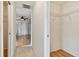 Hallway leads to bedroom and features a closet with wire shelving at 10416 Moshie Ln, San Antonio, FL 33576