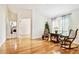 Bright living room with hardwood floors and view of the laundry room at 10416 Moshie Ln, San Antonio, FL 33576