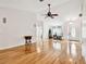 Living room featuring hardwood floors and neutral walls, and a rocking chair at 10416 Moshie Ln, San Antonio, FL 33576