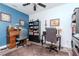 Well-appointed office space with built-in shelving, dual workstations, and ample lighting at 10639 Carloway Hills Dr, Wimauma, FL 33598