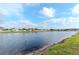 Scenic view of the pond offering a relaxing backdrop to the community at 10639 Carloway Hills Dr, Wimauma, FL 33598