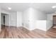 Upstairs hallway features modern flooring and decor at 10639 Carloway Hills Dr, Wimauma, FL 33598