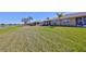 This beautiful backyard has a huge lawn and backs to a lake at 1154 Jameson Greens N Dr # 20, Sun City Center, FL 33573