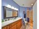 This bathroom has a shower stall, vanity, and big mirror at 1154 Jameson Greens N Dr # 20, Sun City Center, FL 33573