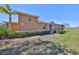 Well-maintained home exterior with manicured lawn and decorative bushes at 1154 Jameson Greens N Dr # 20, Sun City Center, FL 33573