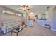 Cozy living room with tile floors, neutral paint, and seamless access to kitchen at 1154 Jameson Greens N Dr # 20, Sun City Center, FL 33573