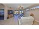 Bright living room with tile flooring, neutral colors, and sliding glass doors leading to an outdoor space at 1154 Jameson Greens N Dr # 20, Sun City Center, FL 33573