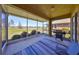 Screened patio with outdoor grill and seating overlooks the pond at 1154 Jameson Greens N Dr # 20, Sun City Center, FL 33573