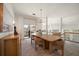 Bright dining room with an open layout, showcasing modern lighting and access to an outdoor balcony at 118 Waterberry Dr, Tarpon Springs, FL 34688