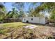 Large backyard featuring a patio and wooden fence, perfect for outdoor activities at 1212 E Crawford St, Tampa, FL 33604