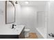 Stylish bathroom with a modern vanity, updated fixtures, and clean, white tile at 1212 E Crawford St, Tampa, FL 33604