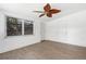 Bright bedroom with new floors, ceiling fan, and ample natural light at 1212 E Crawford St, Tampa, FL 33604