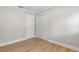 Neutral bedroom with wood-look floors, closet and white trim at 1212 E Crawford St, Tampa, FL 33604