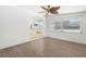 Cozy dining area with modern ceiling fan, arched entryway, and ample natural light at 1212 E Crawford St, Tampa, FL 33604