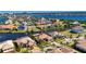 Discover waterfront living from this aerial view of a home nestled within a vibrant, canal-lined community at 1335 Jumana Loop, Apollo Beach, FL 33572
