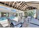 Luxurious backyard with pool, spa, covered patio, and comfortable seating for entertaining or relaxing at 1335 Jumana Loop, Apollo Beach, FL 33572