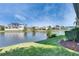 Enjoy waterfront living with this home's backyard view of a tranquil lake, perfect for relaxation at 1335 Jumana Loop, Apollo Beach, FL 33572