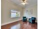 Bright bedroom featuring hardwood floors, natural light, and stylish decor at 1335 Jumana Loop, Apollo Beach, FL 33572