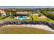 Aerial view of a community pool and playground near waterfront homes at 1335 Jumana Loop, Apollo Beach, FL 33572