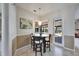 Breakfast nook with a glass table and views of the pool area through a window at 1335 Jumana Loop, Apollo Beach, FL 33572