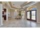 Spacious dining area featuring elegant chandelier lighting and decorative glass double doors at 1335 Jumana Loop, Apollo Beach, FL 33572