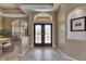 Bright and airy foyer featuring decorative glass doors and tiled flooring at 1335 Jumana Loop, Apollo Beach, FL 33572