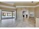 Spacious living area with tile flooring and sliding glass doors leading to the pool area at 1335 Jumana Loop, Apollo Beach, FL 33572