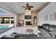 Bright living room features a fireplace, vaulted ceilings, and seamless access to outdoor pool area at 1335 Jumana Loop, Apollo Beach, FL 33572