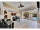 Spacious living room and kitchen featuring tile floors and easy access to the outdoor pool at 1335 Jumana Loop, Apollo Beach, FL 33572