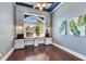 Home office with custom cabinets, hardwood floors, and large window at 1335 Jumana Loop, Apollo Beach, FL 33572