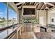 Well-equipped outdoor kitchen with grill, sink, and mini-fridge, perfect for enjoying waterfront views at 1335 Jumana Loop, Apollo Beach, FL 33572