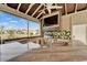 Stylish outdoor kitchen features granite countertops, stainless steel grill, and stunning waterfront views at 1335 Jumana Loop, Apollo Beach, FL 33572