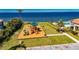 Aerial view of a waterfront community playground complete with a slide, climbing wall and swings at 1335 Jumana Loop, Apollo Beach, FL 33572