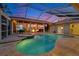 Beautiful screened pool and spa with outdoor kitchen and bar offer perfect outdoor living space at 1335 Jumana Loop, Apollo Beach, FL 33572