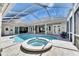 Beautiful in-ground pool and hot tub, with tile trim and a screened-in enclosure for ultimate relaxation and privacy at 1335 Jumana Loop, Apollo Beach, FL 33572