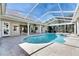 Gorgeous in-ground pool with an attached spa and a screened enclosure for enjoying a pest-free environment at 1335 Jumana Loop, Apollo Beach, FL 33572