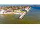 Aerial view of a residential waterfront property with seawall and direct access to the ocean at 1335 Jumana Loop, Apollo Beach, FL 33572