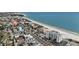 Expansive aerial view of oceanfront real estate near a harbor with residential and commercial buildings at 13500 Gulf Blvd # 505, Madeira Beach, FL 33708