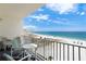 Balcony with seating offering breathtaking views of the beach and ocean at 13500 Gulf Blvd # 505, Madeira Beach, FL 33708