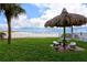 Inviting beachside gazebo with seating offers stunning Gulf views, creating the perfect relaxation spot at 13500 Gulf Blvd # 505, Madeira Beach, FL 33708