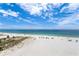 Expansive beach view with crystal waters and white sand, providing a serene coastal lifestyle at 13500 Gulf Blvd # 505, Madeira Beach, FL 33708