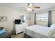 Cozy bedroom with natural light, white furniture, and soft bedding at 13500 Gulf Blvd # 505, Madeira Beach, FL 33708