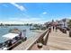 Picturesque boardwalk featuring waterfront views, shops, and boat rentals at 13500 Gulf Blvd # 505, Madeira Beach, FL 33708