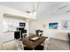 Eat-in kitchen with white cabinetry, modern appliances, and dining table at 13500 Gulf Blvd # 505, Madeira Beach, FL 33708