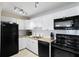 Well-equipped kitchen with stainless steel appliances, granite countertops, and ample cabinet space at 13500 Gulf Blvd # 505, Madeira Beach, FL 33708