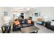 Open living area and kitchen with beachy decor, tile floors, and lots of seating at 13500 Gulf Blvd # 505, Madeira Beach, FL 33708